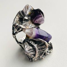 Vintage One Of A Kind Unique Brutalist Ring In Cast Sterling Silver, Tested With A Polished Amethyst Stone In Lovely Purple Violet & Lavender Coloring Swirls Silversmith Made, Eye Catching Piece One Of A Kind Brutalist Style With Its Raw Look. Pair This With Other Mod Jewelry For A Retro Feel This Ring Has Patina, Rubbing, Possible Bending From Use And Storage. Irregularities Due To Its Handmade Design Please Refer To Photos For Condition And Description Brutalist Ring, Mod Jewelry, Purple Violet, Amethyst Stone, Amethyst Ring, Handmade Design, Bending, Vintage Sterling Silver, Patina