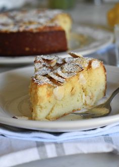 a piece of cake sitting on top of a white plate with a fork in it