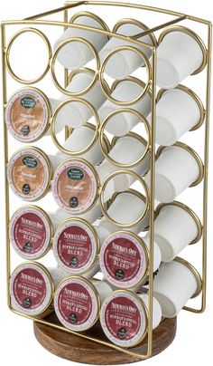 an assortment of coffee cups and sauces in a gold holder