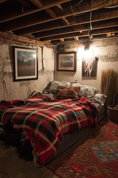 a bed sitting in the middle of a room with pictures on the wall