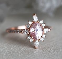 Vintage Pink Sapphire Engagement Ring Rose Gold Oval Peach | Etsy Heirloom Pink Ring With Halo Setting, Exquisite Pink Diamond Ring With Center Stone, Exquisite Pink Diamond Ring With Accent Stones, Exquisite Pink Diamond Ring With Accents, Oval Pink Sapphire Diamond Ring With Accents, Exquisite Pink Diamond Ring With Rose Cut, Pink Oval Sapphire Ring With Halo Setting, Pink Oval Diamond Ring With Center Stone, Pink Marquise Diamond Ring With Prong Setting