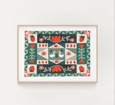 a framed artwork piece hanging on the wall in front of a white wall with an orange and green pattern