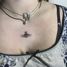 a woman with a small tattoo on her chest