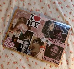 i love new york sticker sheet on a bed with pink and white floral sheets