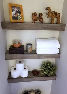 bathroom shelves with toilet paper and other items