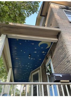 the porch is painted with stars and moon designs