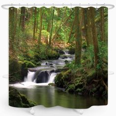 a stream running through a forest filled with lush green trees and rocks shower curtain set