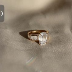 an engagement ring with a baguette cut diamond