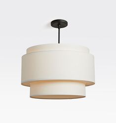 a white light hanging from a ceiling fixture