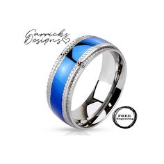 a blue ring with white diamonds in the center and an inscription on it that says,