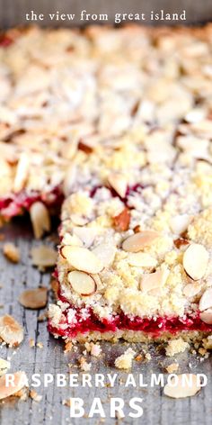 raspberry almond bars on a baking sheet with the title text overlay reads, the view from great island raspberry almond bars