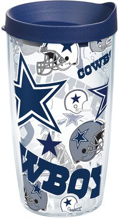 the nfl tumbler cup is decorated with cowboys and football helmets