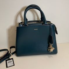 Teal Dkny Bag With Brown Lining And Gold Hardware. Dkny Paige Satchel, Dkny Bags, Dkny Bag, Kate Spade Top Handle Bag, Gold Hardware, Satchel, Top Handle Bag, Color Blue, Bag Lady