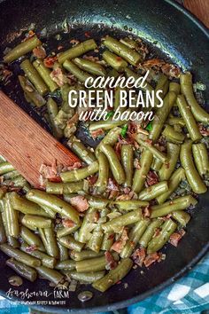 cooked green beans with bacon in a skillet on a blue and white checkered table cloth