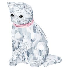 a crystal cat figurine with a pink ribbon around its neck