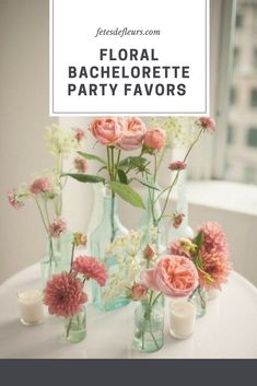 several vases filled with flowers on top of a table