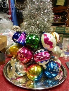 a christmas tree made out of ornaments on a plate