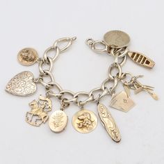 Weight: 56.8 Grams Charms: 17.5 - 23 x 26 mm Bracelet Size:  6.5 Inches Hallmark: F&B, Sterling Item #:  BR-1051-091823-18 Vintage Charm Bracelet, Dream Jewelry, Charm Bracelets, Bracelet Sizes, Vintage Charms, Arm Band, Hallmark, Jewelry Bracelets, Gold Tones