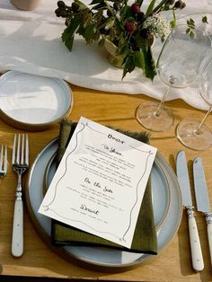 a table set with place settings and silverware