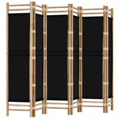 an image of a room divider made out of wood and black canvass with bamboo poles