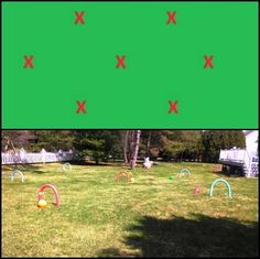 an image of a green screen with red and white crosses on the grass in front of it