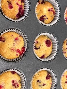 twelve muffins with cranberry topping in the middle are ready to be baked