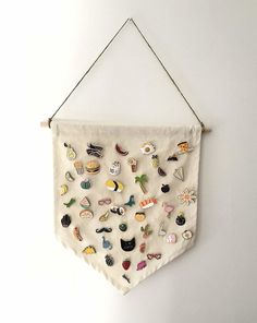 a white wall hanging with various buttons on it