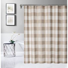 a bathroom with a checkered shower curtain