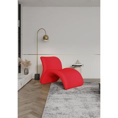 a red chair sitting on top of a rug in a living room next to a white wall