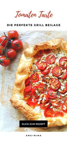 a pizza with tomatoes and nuts on it