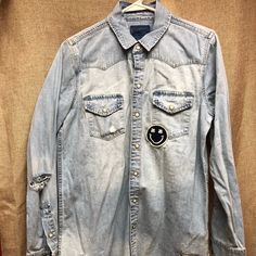 Lucky Brand Denim Patch Shirt With Pearl Snaps. Never Worn. Distressed Cotton Collared Tops, Distressed Collared Cotton Top, Distressed Washed Blue Button-up Top, Distressed Long Sleeve Shirt For Spring, Medium Wash Distressed Button-up Top, Dark Wash Distressed Button-up Top, Distressed Fitted Casual Shirt, Fitted Distressed Casual Shirt, Casual Fitted Distressed Shirt