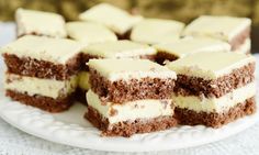 several pieces of cake sitting on top of a white plate