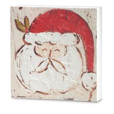 a white and red painting with a santa clause hat on it's head is shown