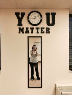 a woman taking a selfie in front of a mirror with the words you matter