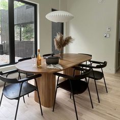 a dining room table with chairs around it