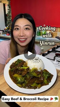 a woman is holding up a plate of food with broccoli and rice on it