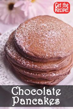 chocolate pancakes with powdered sugar on top and the words get the recipe above it