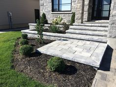 a house with stone steps leading up to the front door