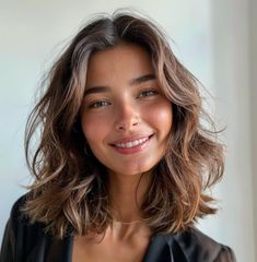 Medium-length layered hairstyles are the best of both worlds, meaning long and short cuts. They offer all the same vibrancy of a short, trendy cut with a Shoulder Length Bobs With Layers, Thick Wavy Hair Short Haircut, Short Thick Hair Wavy, Medium Length Naturally Wavy Hair, Lob Haircut Wavy Hair, Best Haircut For Wavy Hair Medium, Medium Length Haircut Long Layers, Short Wavy Hair Cuts With Layers, Wavy Medium Hairstyles