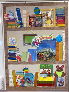 a bulletin board with many books on it