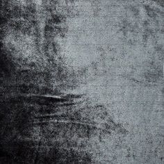 an old black and white photo with some faded paint on the wall in front of it