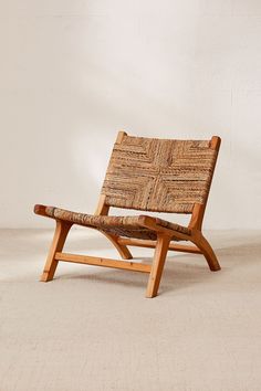 a wooden chair sitting on top of a white floor