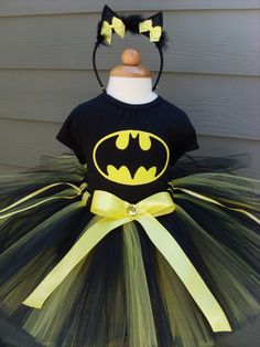 a black and yellow batman tutule dress with cat ears on the headband