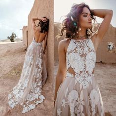 a woman in a dress standing next to a wall