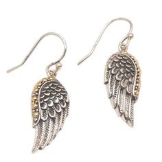 Two wings of a swan are crafted in sterling silver to dangle from the ears with purity. Kadek Wijanegara presents an unforgettable pair of dangle earrings from Bali. Each wing is accentuated with petite bubbles of 18k gold. Elegant Winged Earrings For Gift, Silver Sterling Silver Winged Earrings, Silver Winged Sterling Silver Earrings, Winged Sterling Silver Earrings In Silver, Pierced Winged Earrings As Gift, Elegant Silver Winged Earrings, Sterling Silver Winged Earrings Gift, Winged Sterling Silver Earrings For Gift, Winged Sterling Silver Earrings As Gift