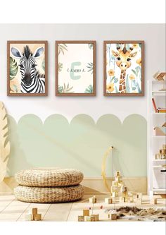 three framed pictures hang on the wall in a children's room with zebras and giraffes