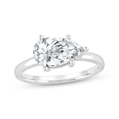 a white gold engagement ring with two pear shaped diamonds