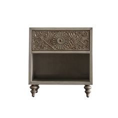 an antique style nightstand with carvings on the top and bottom shelf, in grey wood