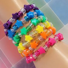 These kandi bracelets are made with rainbow,glitter pony beads and cute star beads. These measure 7 inches. Includeds 6 kandi bracelets one in each color. This Item is made to order. Perfect for any event! You will get lots of compliments in this unique wearable art! Stand out at your next event! Edm festival  Raves Party  Rave outfit  Festival outfit Pride Party favor Birthday gift Stocking stuffer Christmas gift Glow party Rave birthday  Rave gift Rave Beads Bracelets, Star Kandi Bracelet, Kandi Star Bracelet, Candy Bead Bracelet Ideas, Pride Kandi Bracelets, Kandi Inspo Cuff, Lots Of Bracelets On Wrist, Kandi Bracelets Cuff, Rave Candies