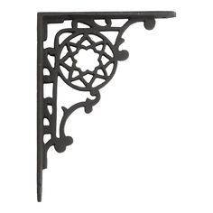 an iron shelf bracket with decorative designs on it's sides and the top section missing